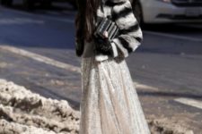 With light gray maxi skirt, black clutch and flat boots