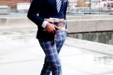 With navy blue blazer, striped tie and pink sneakers