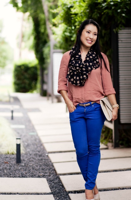 With pale pink blouse, blue pants, beige shoes and clutch