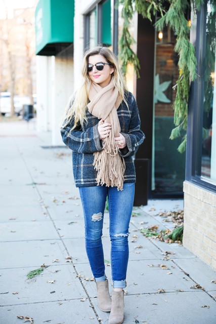 With plaid oversized shirt, cuffed jeans and suede boots