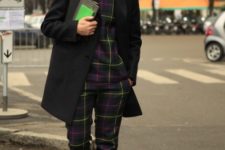 With plaid shirt, black coat and sneakers