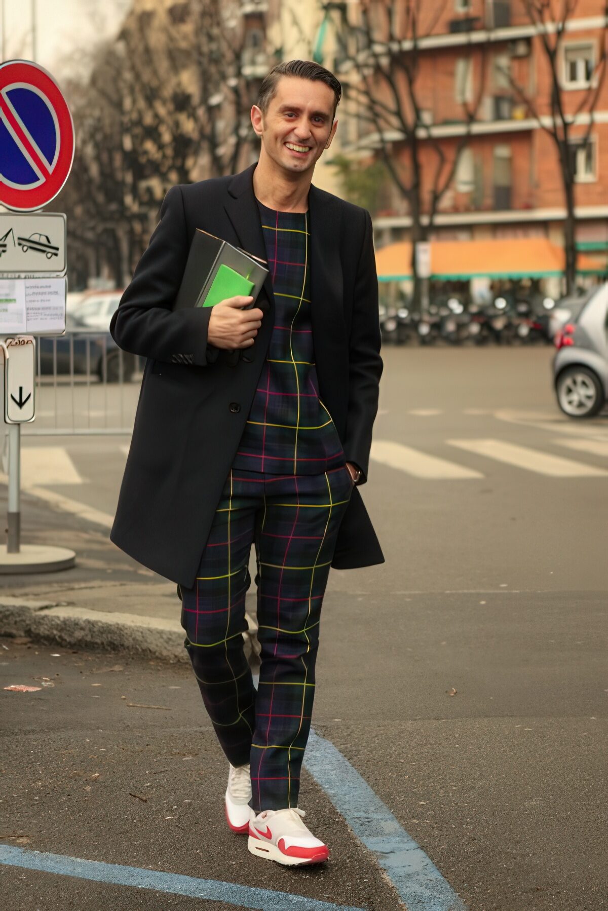 With plaid shirt, black coat and sneakers