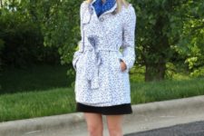 With printed coat, black skirt and blue flats