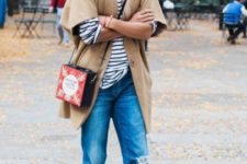 With striped shirt, camel cardigan, cuffed jeans, ankle boots and unique bag
