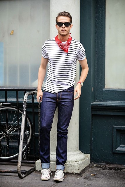 With striped shirt, cuffed jeans and sneakers