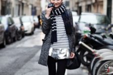 With striped shirt, silver shorts, black tights, black flat boots, tweed coat and black bag