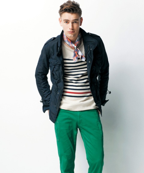 With striped sweater, navy blue jacket and green pants