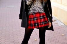 With sweater, leather jacket, black tights and ankle boots