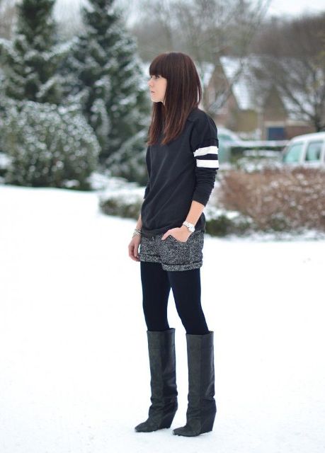 With sweatshirt, black tights and high boots