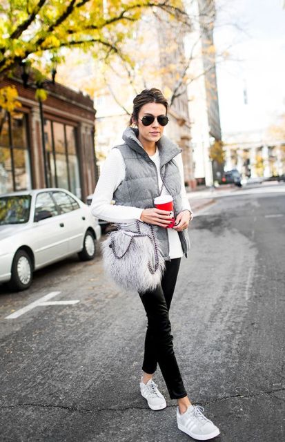 With white shirt, gray puffer vest, black pants and white sneakers