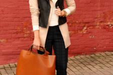 With white sweater, beige coat, black trousers, pumps and brown tote