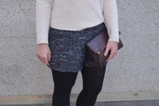 With white sweater, gray suede boots and clutch
