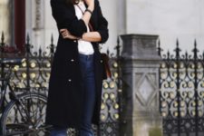 With white t-shirt, black coat, flare jeans and platform shoes