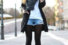 With white t-shirt, black coat, gray scarf and ankle boots