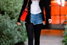 With white t-shirt, black tights, black beanie, heels, printed scarf, red bag and black jacket