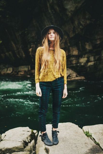 With yellow shirt, wide brim hat and ankle boots