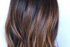 a dark brunette, almost black long bob, with caramel balayage and a bit of texture is a lovely idea to rock