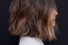 a dark brunette long bob with caramel highlights and a blonde money piece is a lovely and chic solution