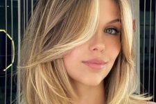 an elegant bronde long bob with blonde balayage and blonde money piece is a chic and very refined idea