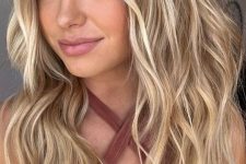 beautiful long volumetric hair with bleached blonde balayage and waves is a lovely and stylish idea to rock