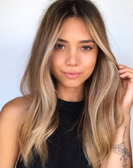 dark hair with beautiful warm blonde balayage and face-framing highlights is a lovely and fresh idea