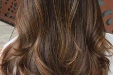 long dark brown hair with delicate caramel babylights and mathing ends for a dimensional and eye-catchylook