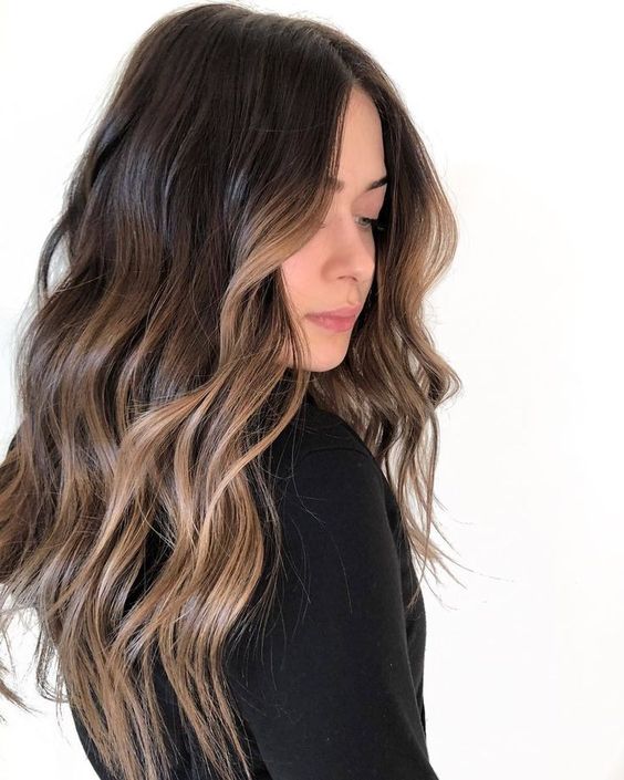 long dark brunette hair with delicate bronde balayage is a gorgeous idea to try, these highlights will accent the face