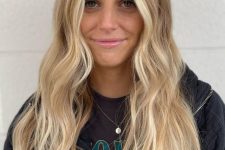 long hair with blonde balayage and money piece, waves and volume is a stylish and chic idea to rock