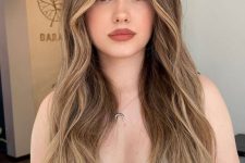 long light brunette hair with blonde balayage and face-framing highlights, volume and waves is amazing