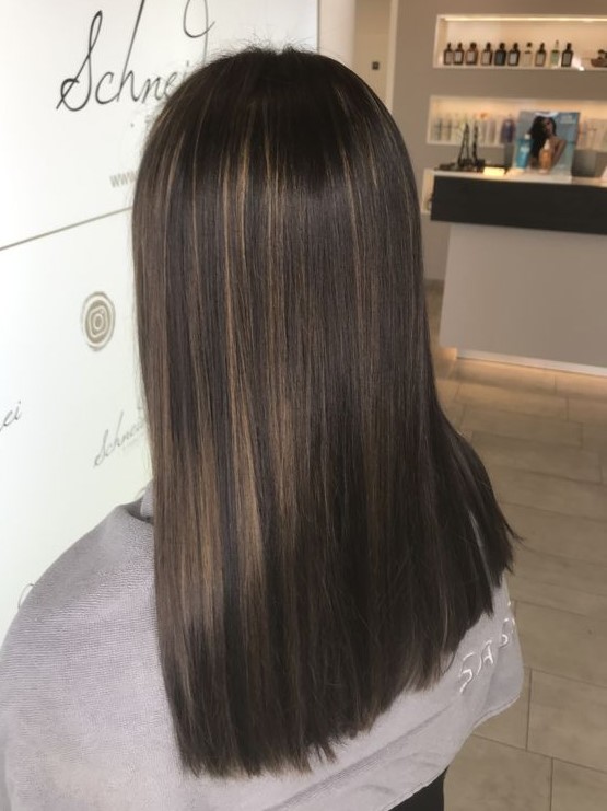 long straight dark brown hair with delicate bronde babylights that make hair look interesting and create and a contrast