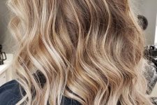 long volumetric hair with delicate honey blonde balayage and waves is a stunning solution to rock