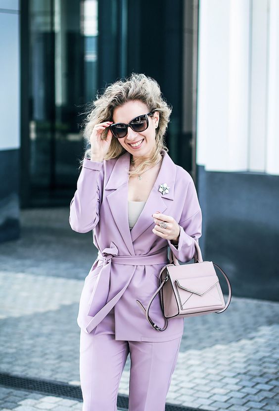 a lilac pantsuit with a neutral top and a blush bag can be worn to the office by romantic girls