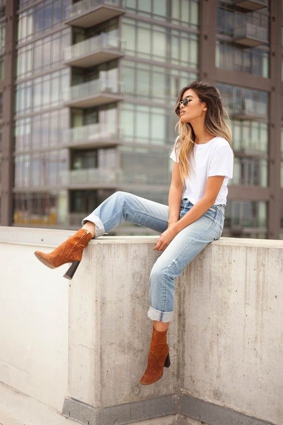 a white tee, distressed cuffed jeans and amber suede booties for a relaxed look