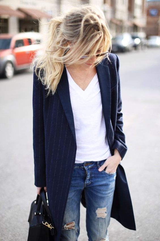 ripped jeans, a white tee, a navy striped long blazer and a black bag for a casual work look