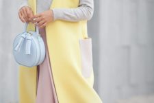 08 a grey long sleeve, a pink midi skirt, a yellow sleeveless coat and a powder blue bag
