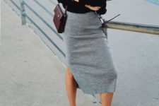08 a grey pincil midi skirt with a slit, black and white trainers, a black top and a burgundy bag