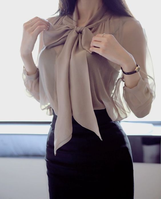 an ethereal chiffon blouse with a large bow and a black pencil skirt for a grilish feel
