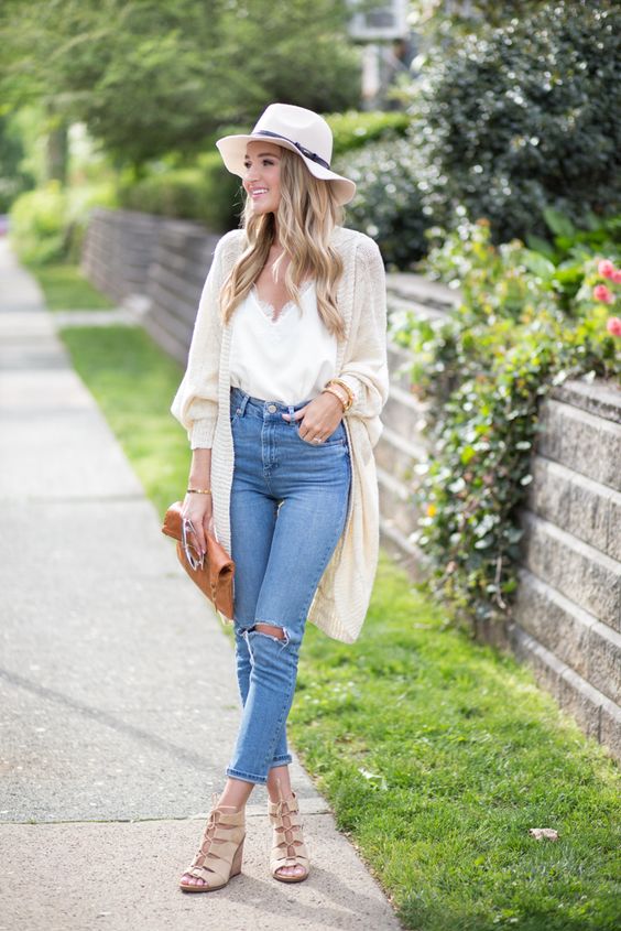 blue ripped jeans, a white top with lace, a light cardigan, nude cutout shoes and a hat