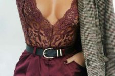 10 a plum-colored lace bodice worn under a jacket, no shirt