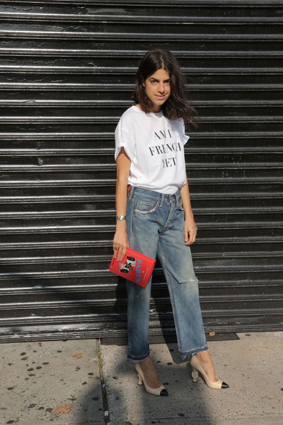 high waisted straight jeans, heels, a printed tee and a clutch