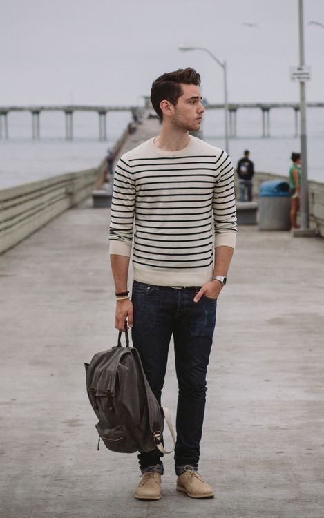 dark denim, beige shoes, a striped top with long sleeves and a backpack