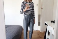 grey cropped trousers, a black and white striped top, white sneakers to go to work