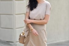 With beige shirt and beige leather mini bag