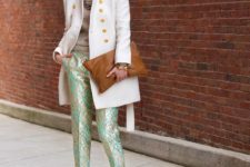With beige shirt, white coat, black pumps and brown clutch