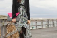 With black blazer, platform shoes and gray and pink clutch