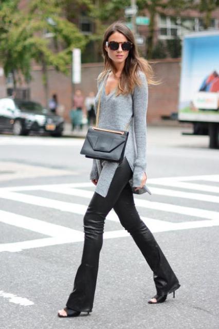With black leather flare pants, heels and chain strap bag