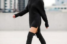 With black over the knee boots and black wide-brim hat