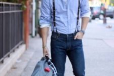 With blue shirt, cuffed jeans, brown boots and bag