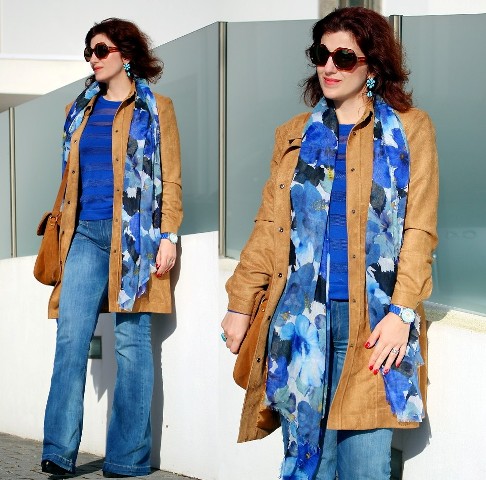 With blue shirt, flare jeans, black boots and brown suede coat