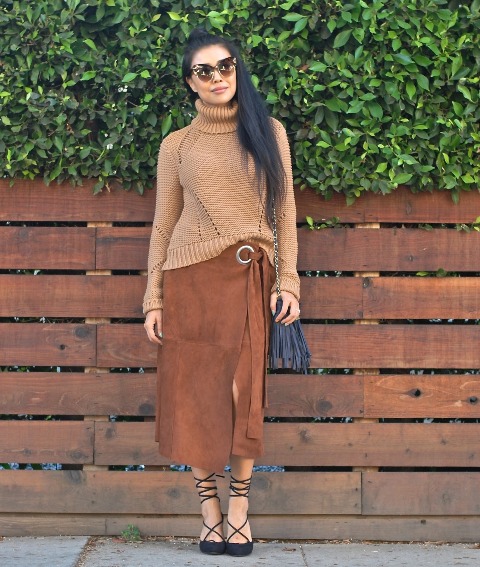 With brown sweater, lace up shoes and fringe bag